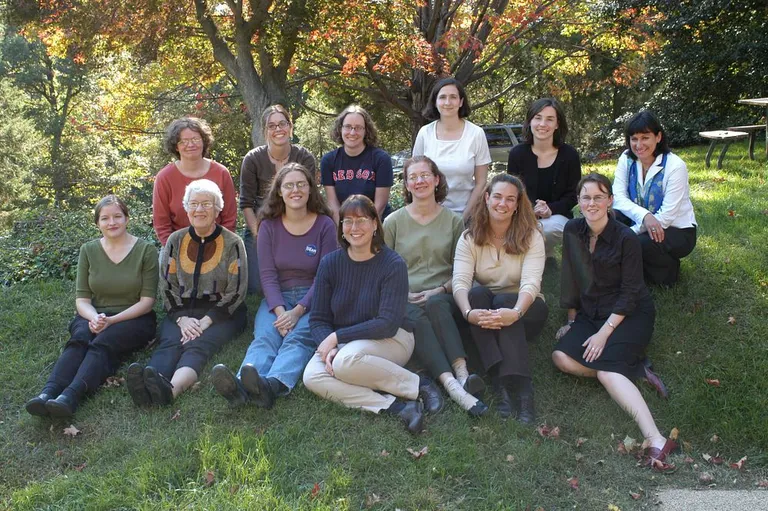 Vera Rubin was a firm advocate for women in science and her mentorship helped guide generations of researchers. This picture of the women staff and scientists at the Department of Terrestrial Magnetism was taken in 2003.  

​​​​​​Front row left to right: Brooke Hunter, Vera Rubin, K.E. Saavik Ford, Alycia Weinberger, Mary Horan, Kathleen Flint, Alexis Clement.  Back row left to right: Linda Warren, Alison Shaw, Katherine Kelley, Sara Seager, Lucy Flesch, Jan Dunlap.