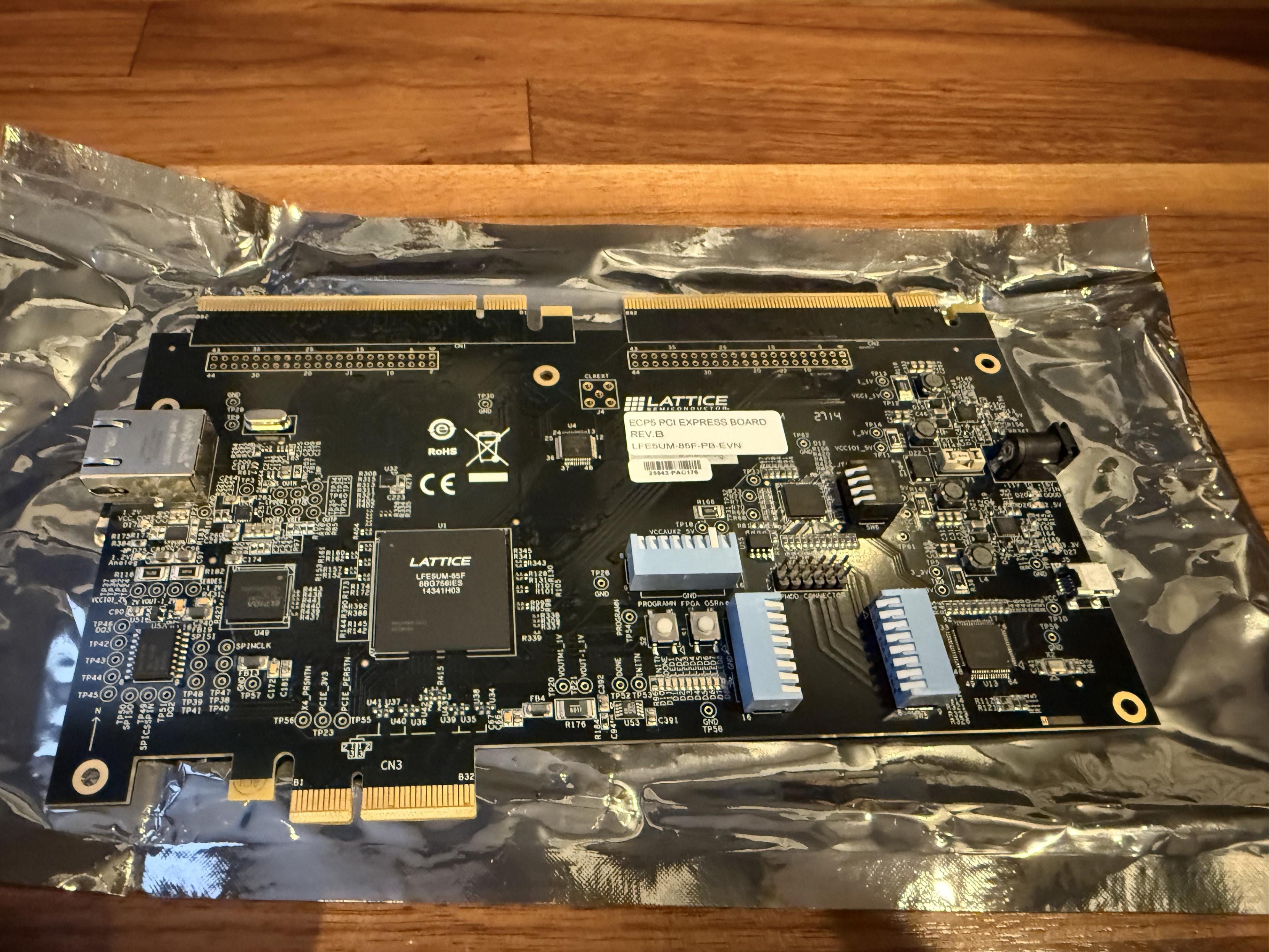Lattice ECO5 PCI Express Board Rev B with a LFE5UM-85F on it, PCIE edge, Ethernet, expansion headers, and DIP switches