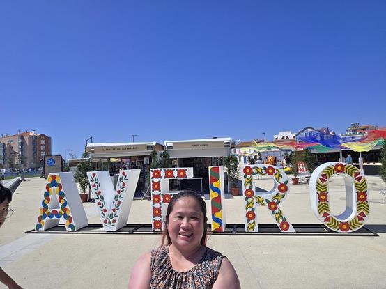 Mariatta in front of the AVEIRO letters