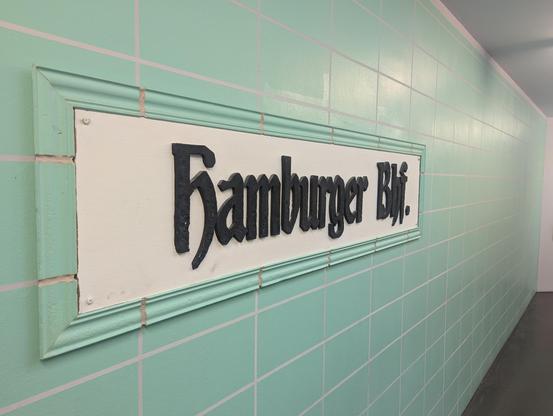 Faux rendering of the Hamburger Bahnhof station name in a gothic art deco style.