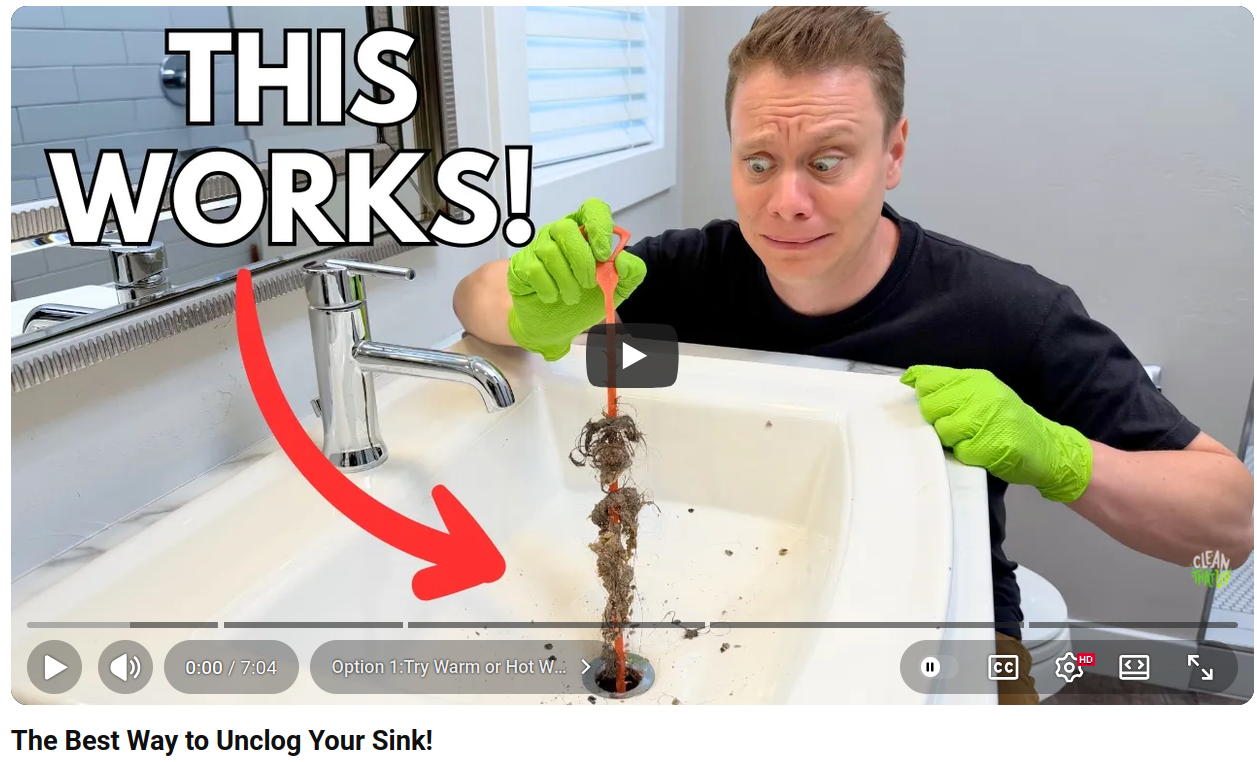 A youtube thumbnail showing the same setting as the first thumbnail, a guy cleaning out a clogged sink with the text "This works!", but it's a different person. this is the original video, the other AI generated video ripped this one off.